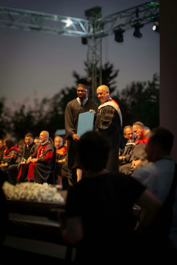 A group of men standing next to each other on a stage